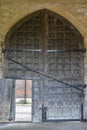 An old wooden medieval gate with a stone wall Royalty Free Stock Photo