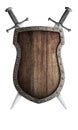 Old wooden medieval shield and two crossed swords