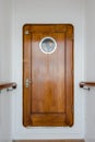 Old wooden narrow door on vintage ship