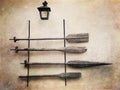 Old wooden oars on the wall. Retro styled photo