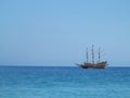 Old wooden old ship in blue sea Royalty Free Stock Photo