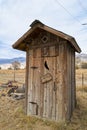 An old wooden outhouse with an out of order sign Royalty Free Stock Photo