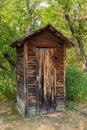 Old Wooden Outhouse In The Woods