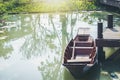 Old wooden paddle boat parked in a quiet harbor. Royalty Free Stock Photo