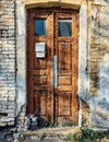 An old wooden painted cracked close brown door