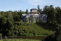 The old wooden palace Nabokov on a hill near the river Oredezh. Royalty Free Stock Photo