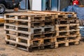 Old wooden pallets storage on warehouse at a construction site, close-up