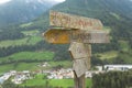 Old wooden path sign on Lutago - Luttach a mountain little town Royalty Free Stock Photo