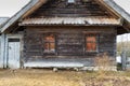 old wooden peasant hut with a bench, front view Royalty Free Stock Photo