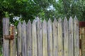 Old wooden picket gate with peeled paint Royalty Free Stock Photo