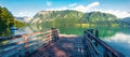 Old wooden pier on Bohinj lake. Colorful summer view of Triglav national park. Beautiful morning scene of  Slovenia, Alps, Europe Royalty Free Stock Photo