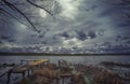 Old wooden pier with dry reed Royalty Free Stock Photo