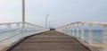 Old wooden pier at Henley Beach, Australia with a cloudy sky in the background Royalty Free Stock Photo