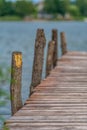 Old wooden pier with a lake in the background Royalty Free Stock Photo