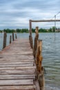 Old wooden pier with a lake in the background Royalty Free Stock Photo