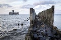 Old wooden pier and ruins of torpedo factory Royalty Free Stock Photo