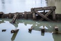 Old wooden pier sticks out of the water Royalty Free Stock Photo