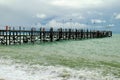 Old wooden pier stretching out to sea Royalty Free Stock Photo