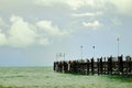 Old wooden pier stretching out to sea Royalty Free Stock Photo