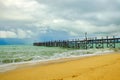 Old wooden pier stretching out to sea Royalty Free Stock Photo
