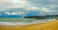 Old wooden pier stretching out to sea Royalty Free Stock Photo