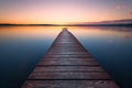 Old wooden pier at sunset. Long exposure Royalty Free Stock Photo