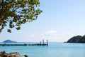 Old wooden pier in the tropical sea. Royalty Free Stock Photo