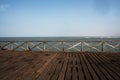 old wooden pier with railing in the pacific ocean and blue sky pimentel chiclayo per