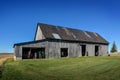 Old wooden plank barn for storing tractors and farm equipment Royalty Free Stock Photo