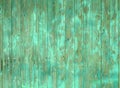 Old wooden plank wall or fence with old faded peeling green paint Royalty Free Stock Photo