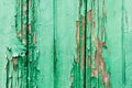 Old wooden planks with cracked peeling green paint. Painted texture background. Rustic background Royalty Free Stock Photo