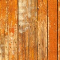 Old wooden planks painted with brown paint cracked by a rustic b