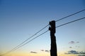 Old wooden pole with electric wire. Royalty Free Stock Photo