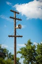 On an old wooden pole, an old megaphone. vertical frame Royalty Free Stock Photo