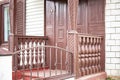 Old wooden porch. Entrance to the house. Old wooden structures. Architecture and construction. Preservation of old structures