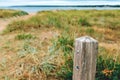 Old wooden post on West Beach in Halmstad, Sweden Royalty Free Stock Photo
