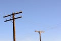 Old wooden power poles with glass insulators Royalty Free Stock Photo