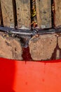 Old wooden press with must inside. Pressing grapes for red wine. Royalty Free Stock Photo