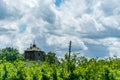 Old wooden prison watchtower in work camp built during the world war two with trees and blue sky with clouds Royalty Free Stock Photo