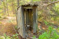 An old wooden privy at a mining camp in the yukon