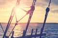 Old wooden pulley block silhouettes at sunset, color toning applied, selective focus Royalty Free Stock Photo