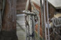 Old wooden pulley block with weathered ropes on an historic sailing boat Royalty Free Stock Photo