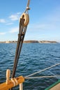 Old wooden pulley with land on horizon Royalty Free Stock Photo