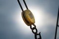 Old wooden pulley and metal hook mountain on a classical sailboat Royalty Free Stock Photo