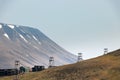 Old wooden pylons for coal-transport carts cables at the edge at Longyearbyen, Svalbard Royalty Free Stock Photo