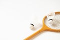 Old wooden racket and shuttlecock closeup on a white background, sport Royalty Free Stock Photo