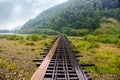 Old wooden railway bridge with footpath Royalty Free Stock Photo