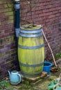 Old wooden rain barrel for rainwater harvesting Royalty Free Stock Photo