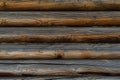 Old wooden red brown gray wall made of round logs. Texture background. Russia Royalty Free Stock Photo