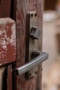 Old wooden red door with a metal handle Royalty Free Stock Photo